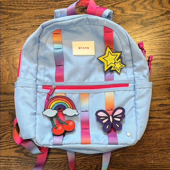 Kane Girl's STATE Backpack in periwinkle blue and tie dye straps with charms - Picture 1 of 8